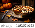 Cut pumpkin pie revealing a rich golden spiced filling is elegantly served on a rustic wooden table  105851052