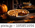 Cut pumpkin pie revealing a rich golden spiced filling 105851056