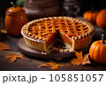 Cut thanksgiving pumpkin pie revealing a rich golden spiced filling is elegantly served on a rustic wooden table  105851057
