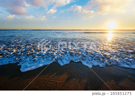 Atlantic ocean sunset with surging waves at Fonte da Telha beach, Costa da Caparica, Portugal 105851275