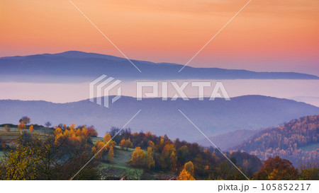 carpathian mountain landscape in autumn. beautiful countryside scenery. foggy sunrise carpathian mountain landscape in autumn. beautiful countryside scenery. foggy sunrise 105852217