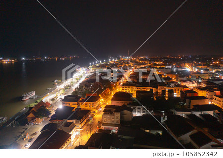 Aerial view of residential neighborhood roofs. Urban housing development from above. Top view. Real estate in Nakhon Phanom province city, Thailand. Property real estate at night. 105852342