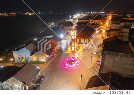 Aerial view of clock tower roundabout. Urban housing development from above. Top view. Real estate in Nakhon Phanom province city, Thailand. Property real estate at night. Aerial view of clock tower roundabout. Urban housing development from above. Top view. Real estate in Nakhon Phanom province city, Thailand. Property real estate at night. 105852348