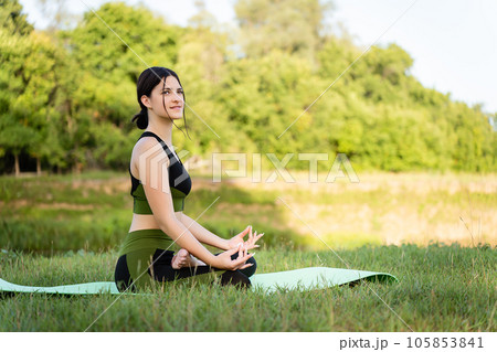 sportswear and accessories of the girl embody comfort and freedom of movement during the practice of yoga in nature 105853841