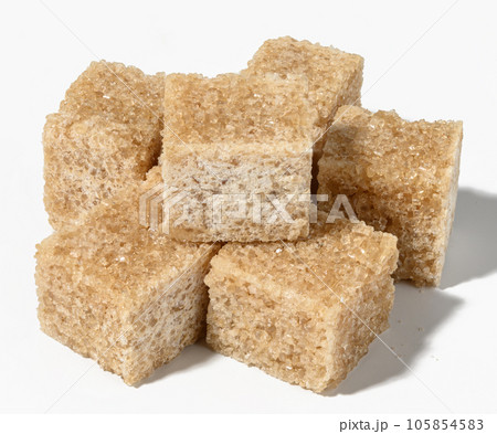 Cane sugar cubes on white background 105854583