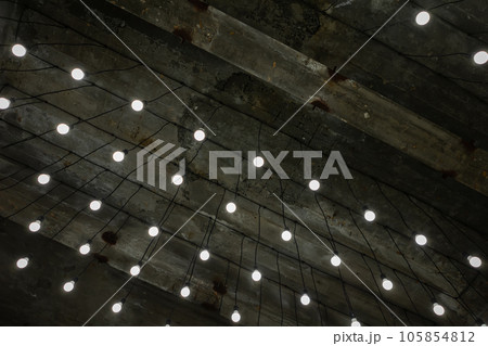 Office, factory or warehouse concrete ceiling with wires and lamps. Office, factory or warehouse concrete ceiling with wires and lamps. 105854812