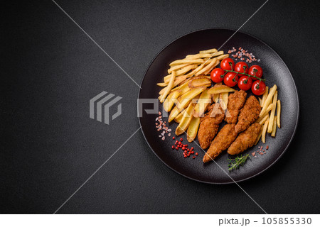 Delicious crispy chicken nuggets breaded with salt and spices 105855330