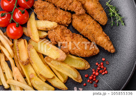 Delicious crispy chicken nuggets breaded with salt and spices 105855336