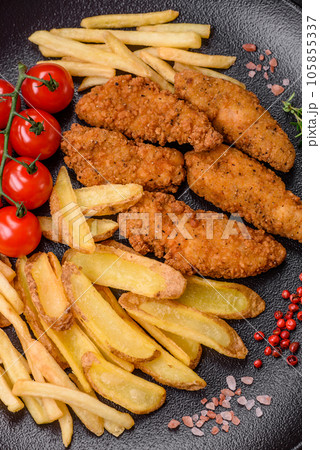 Delicious crispy chicken nuggets breaded with salt and spices 105855337