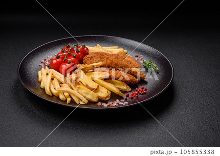Delicious crispy chicken nuggets breaded with salt and spices 105855338