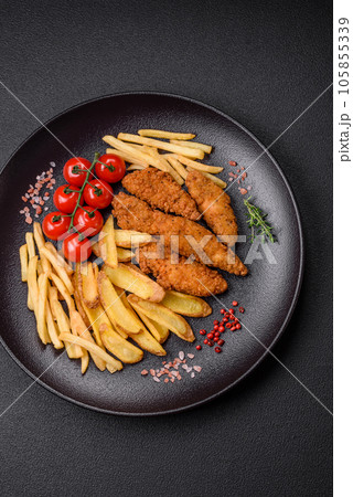 Delicious crispy chicken nuggets breaded with salt and spices 105855339