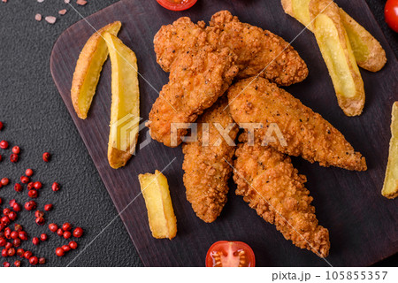 Delicious crispy chicken nuggets breaded with salt and spices Delicious crispy chicken nuggets breaded with salt and spices 105855357