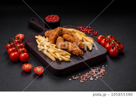 Delicious crispy chicken nuggets breaded with salt and spices 105855390