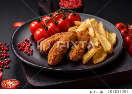 Delicious crispy chicken nuggets breaded with salt and spices Delicious crispy chicken nuggets breaded with salt and spices 105855398