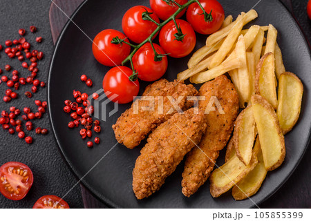 Delicious crispy chicken nuggets breaded with salt and spices 105855399