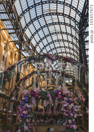 Flower decoration at entrance of Hays Galleria. Its iron and glass covered concourse with boutique shops, chain stores and restaurants. Its iconic tourist attraction in London for visitor. 105857973