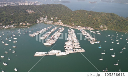 drone point of view of typhoon shelter which park full of yachts in sai kung 105858618