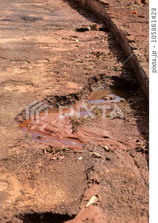 hole in asphalt street hole in asphalt street 105861428