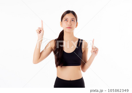 Portrait of beautiful young asian woman in sportswear smile and presenting isolated. Portrait of beautiful young asian woman in sportswear smile and presenting isolated. 105862349