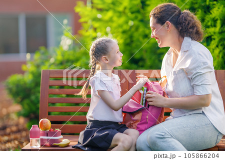 Parent and kid going to school Parent and kid going to school 105866204
