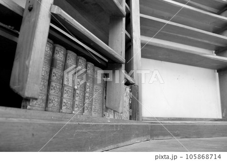 Personal library consisting of big empty bookcase with wooden bookshelf for books 105868714
