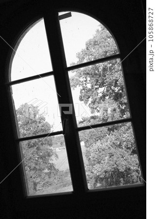 Beautiful wooden frame window in old building without people Beautiful wooden frame window in old building without people 105868727