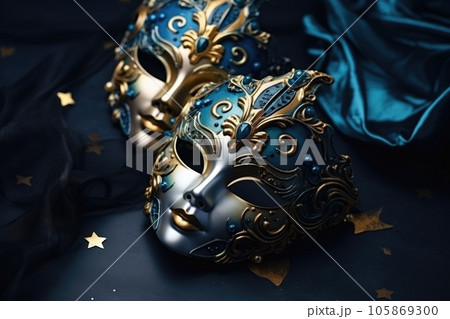 Festive Venetian carnival mask with gold decorations on dark blue background. 105869300