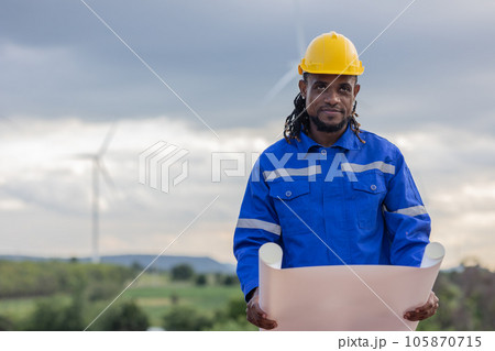 Wind turbine technician checking service. Black African Engineer professional working maintenance clean power generator system Wind turbine technician checking service. Black African Engineer professional working maintenance clean power generator system 105870715