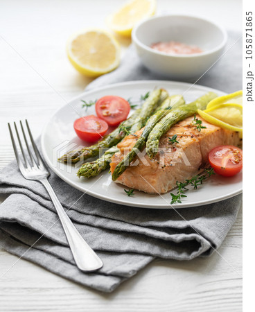 Baked Delicious salmon, green asparagus on plate Baked Delicious salmon, green asparagus on plate 105871865