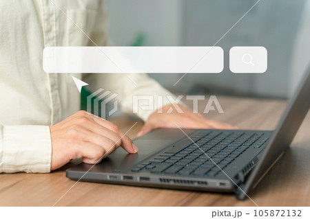 Man working with a laptop computer on the table. Search engine optimization of the internet with the search bar. Best SEO technology networking, Searching browsing internet data information concept. 105872132