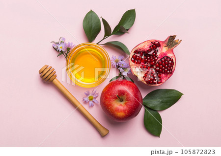 Flat lay composition with symbols jewish Rosh Hashanah holiday attributes on colored background, Rosh hashanah concept. New Year holiday Traditional. Top view with copy space 105872823