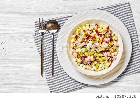 Sweet Apple Salad with celery, marshmallows, pecan 105873329