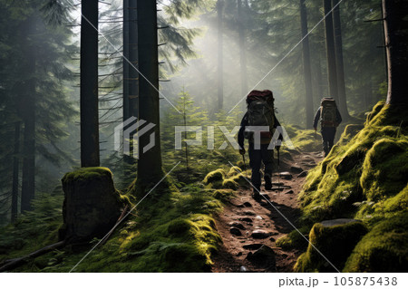 Trekking through the forest with backpacks Trekking through the forest with backpacks 105875438