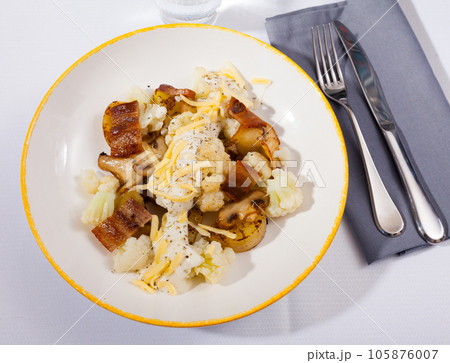 Cauliflower with potatoes and brisket meat served with cheese sauce Cauliflower with potatoes and brisket meat served with cheese sauce 105876007