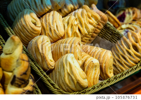 Image of fresh puff cakes at counter in supermarket Image of fresh puff cakes at counter in supermarket 105876731