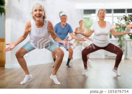 Mature woman with visitor actively moves and learns to dance hip hop Mature woman with visitor actively moves and learns to dance hip hop 105876754