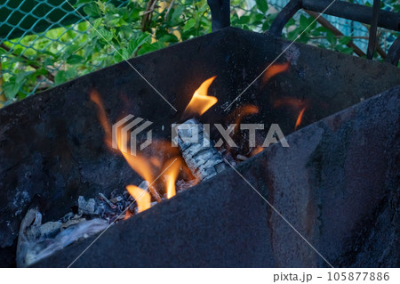 Burning coals in the grill close up 105877886