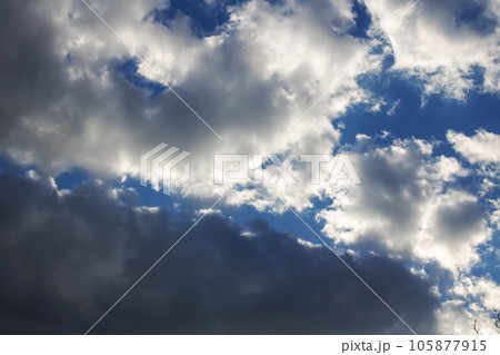 Dark blue clouds in a stormy sky 105877915