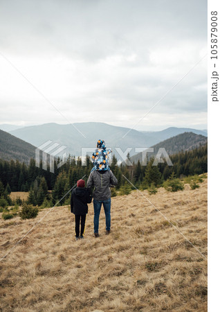 Two Brother boys stand at the top of the mountain. Ukrainian Carpathians 105879008
