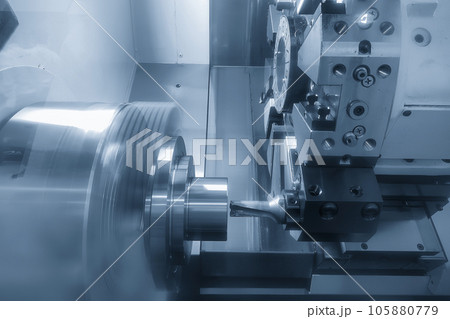The CNC lathe machine hole cutting the metal shaft parts by drill tool. The CNC lathe machine hole cutting the metal shaft parts by drill tool. 105880779