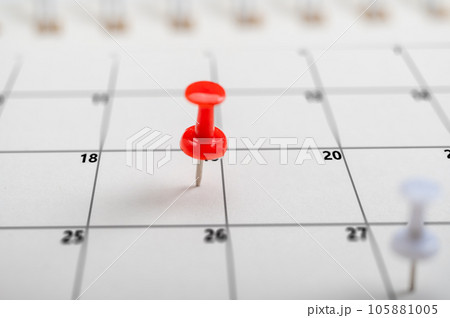 Colorful Push pin in calendar. Calendar page pinned in calender on date, business meeting schedule or travel planning concept. and reminder concept. Calendar appointment 105881005