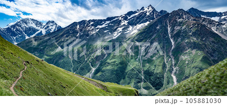 Mountains landscape. snow-capped peaks. Idyllic mountain background. Panoramic view of beautiful mountain landscape Mountains landscape. snow-capped peaks. Idyllic mountain background. Panoramic view of beautiful mountain landscape 105881030