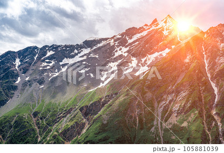 Amazing mountain landscape with colorful vivid sunset on cloudy sky, natural outdoor travel background. Panorama mountain summer landscape. Summer mountain landscape 105881039