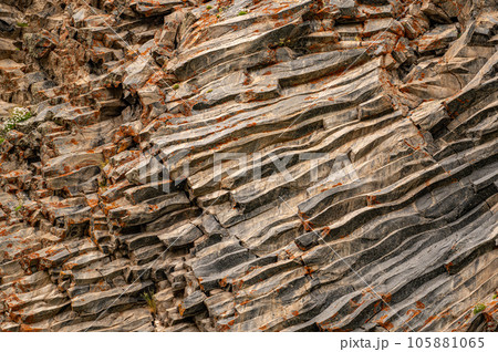 natural stone background texture. rock formation, unusual mountain topography, geological backdrop. Basalt columns formation 105881065