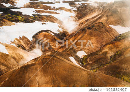 Kerlingarfjoll mountain range on geothermal area and sulphur smoke in summer at Iceland 105882407