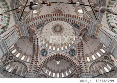 Ceiling of Ottoman Fatih Mosque in Istanbul, Turkey, made up of a series of decorated domes based on Islamic art 105884299
