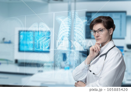 Doctor monitors X-rays on a virtual computer screen. Doctor monitors X-rays on a virtual computer screen. 105885420