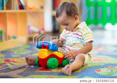 Cute baby boy in kindergarten or daycare. Cute baby boy in kindergarten or daycare. 105886518
