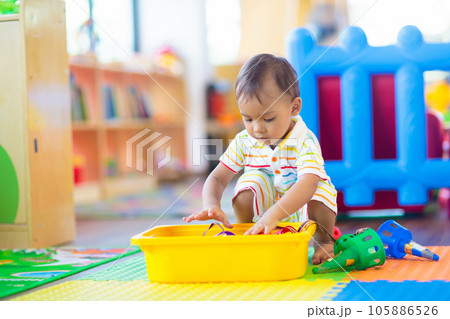 Cute baby boy in kindergarten or daycare. Cute baby boy in kindergarten or daycare. 105886526