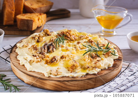 Butter board with honey and nuts sweet dessert on the table 105887071